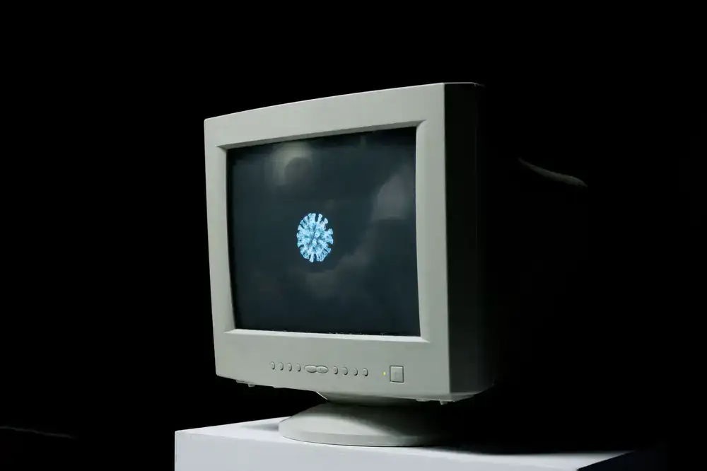 Glowing CRT monitor displaying retro graphics