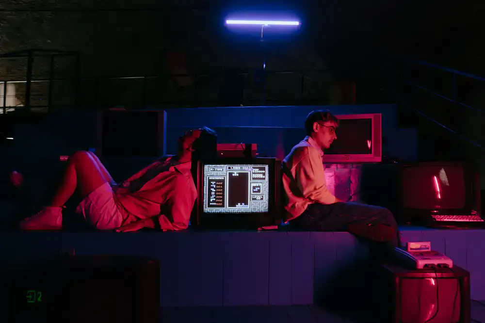 Close up of a glowing CRT monitor displaying retro pixels